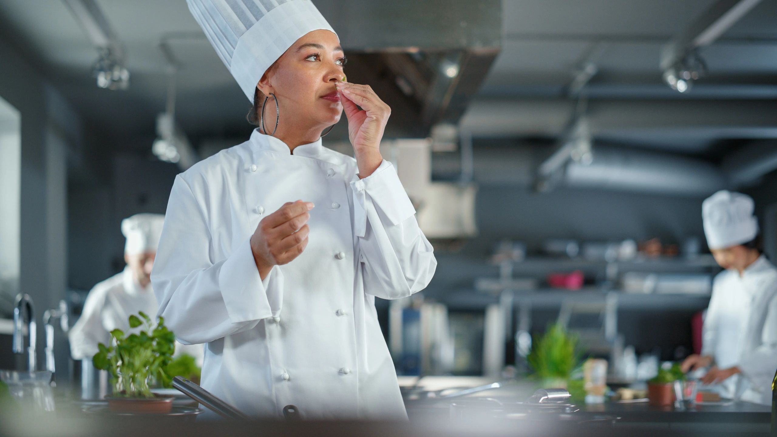 Chef preparing food in a professional restaurant kitchen