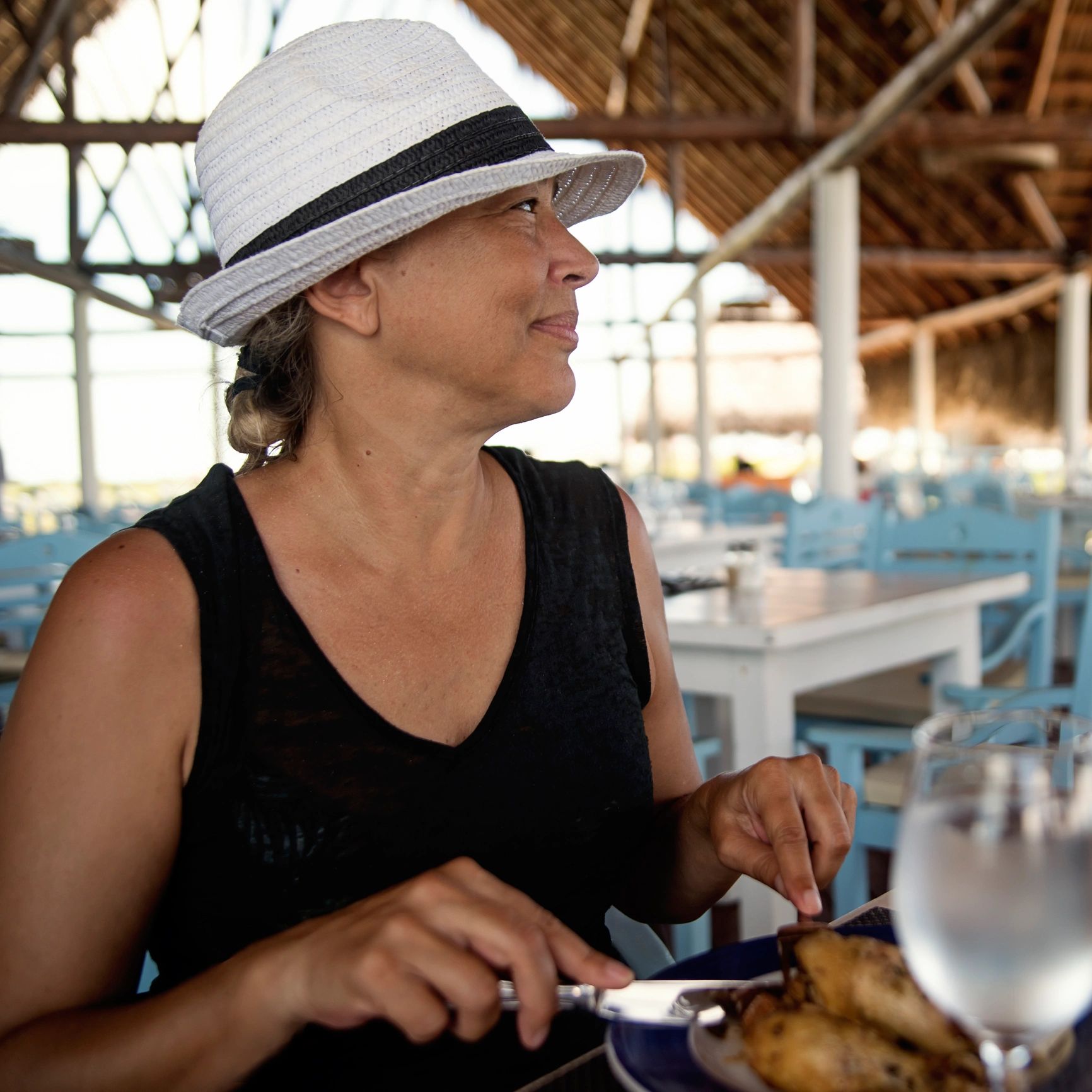 Happy guest dining outdoors at a restaurant